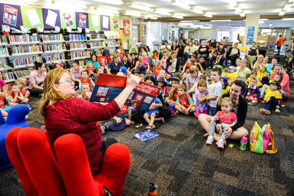 Shellharbour Mayor Marianne Saliba reads to children at Warilla Library during last week's National Simultaneous Storytime. Picture: GEORGIA MATTS