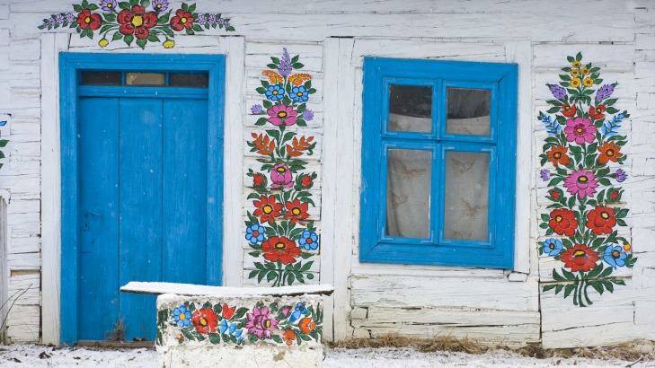 Floral folk decoration on a house in Zalipie, Poland. Photo: iStock