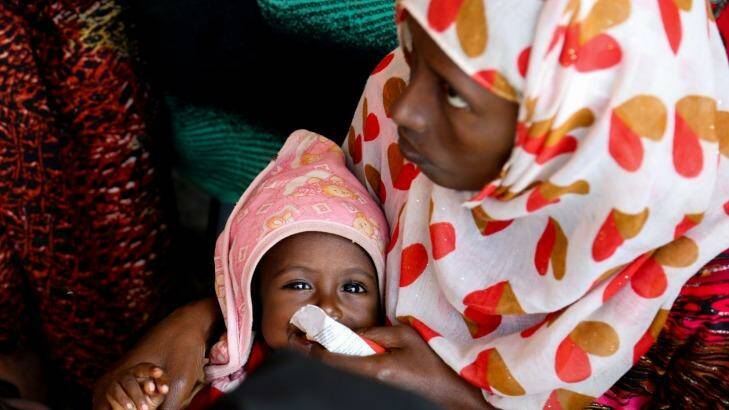 Medina Humed feeds her baby, Ahmed Abdu, emergency food at a health post in Dubti, Ethiopia's Afar region. Photo: Jay Court