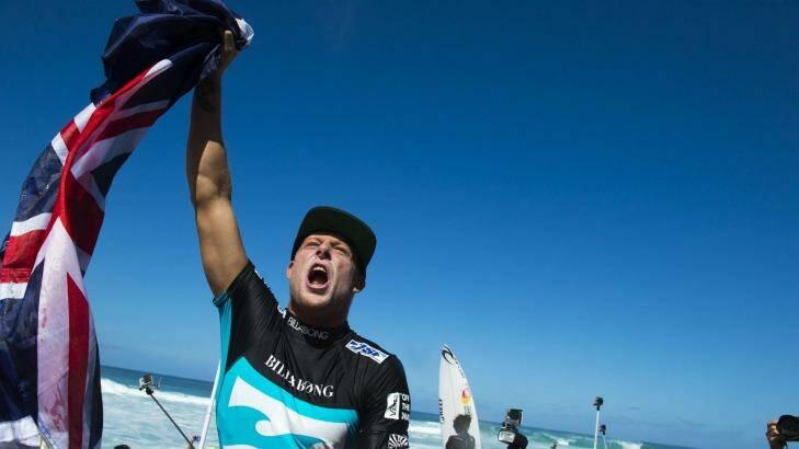 Top once again: Mick Fanning celebrates claiming is third world title. Photo: ASP