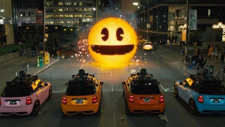 Inky, Blinky, Clyde and Pinky take on Pac-Man in <i>Pixels</i>.
