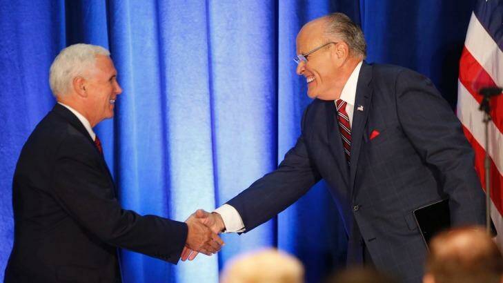 Republican vice presidential candidate, Mike Pence, left, shakes hands with former New York Mayor Rudy Giuliani, before Republican Presidential candidate Donald Trump spoke in Youngstown, Ohio. Photo: AP Photo/Gerald Herbert