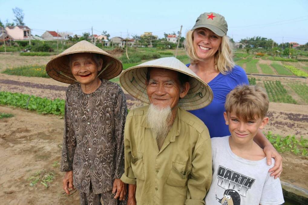 Happy tourists: Tracey Spicer and her son loved travelling through Vietnam and meeting locals. Photo: Jason Thompson