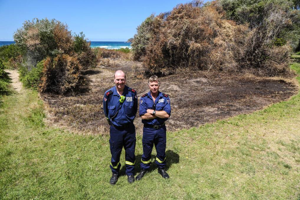Kiama Fire Brigade deputy captains Matt Daly and Terry Dryburgh at the site of a recent deliberately-lit fire at Jones' Beach. Picture: GEORGIA MATTS