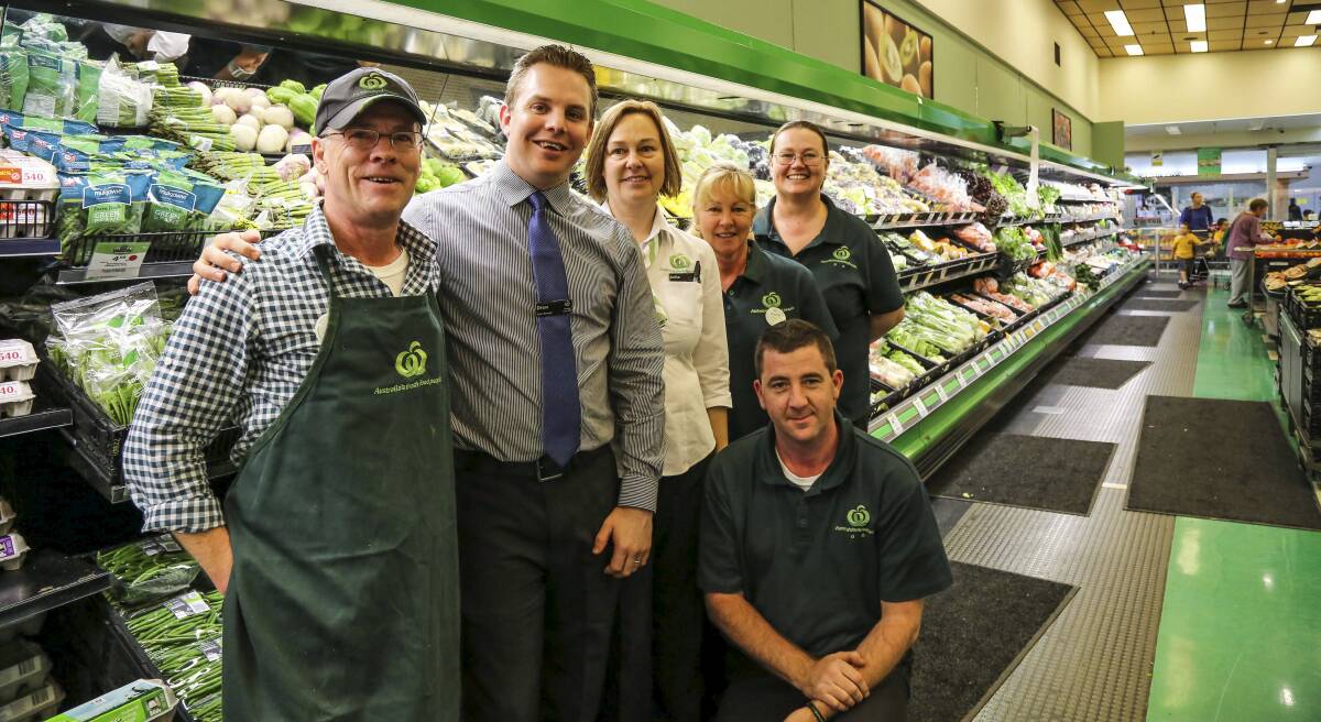 Bill Stevens, Kiama Woolworths store manager Drew Burns, with staff, Anita Smith, Rhonda Rossini, Dean Coaleg and Leanne Pubis who are excited to see the store's new refit take shape. Picture: GEORGIA MATTS