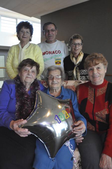 Adelina Mifsud (middle) celebrates her 102nd birthday with her children Nelly Dimech, Nina Formosa, Oscar Mifsud, Melita Mallia and Elsie Magro. Other children absent from the photo are Polly Magro, Mary Camelleri, Joey Mifsud and Charlie Mifsud. Picture: ELIZA WINKLER