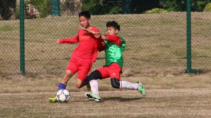 Next generation: Evergrande Football School(ESF) students train to be professional soccer players. Photo:  Sanghee Liu.