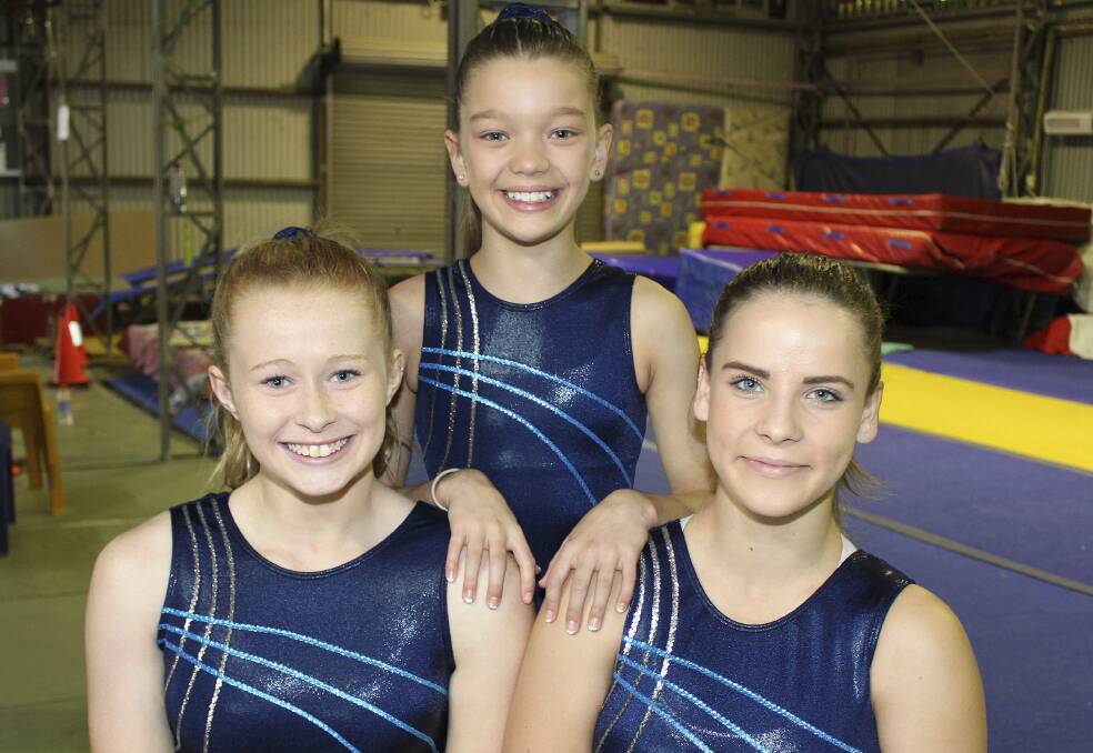 Oak Flats Albion Park Gymnastics & Acrobatics Club members Maddison Lacey, Jessica Adams and Mikayla Stephens, who will compete in the World Age Games in July. Picture: DAVID HALL
