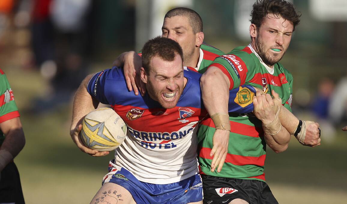 Gerringong Lions' rampaging utility player Lloyd Bowen tries to break through the Jamberoo defence on Saturday. Picture: DAVID HALL