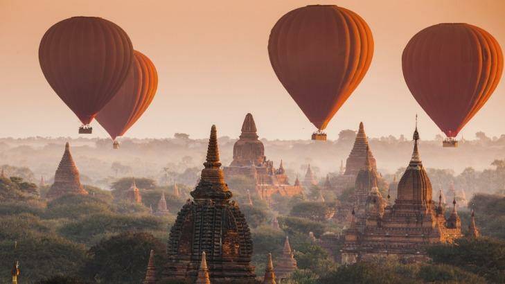 Hot air balloon over plain of Bagan in misty morning, Myanmar. Photo: iStock