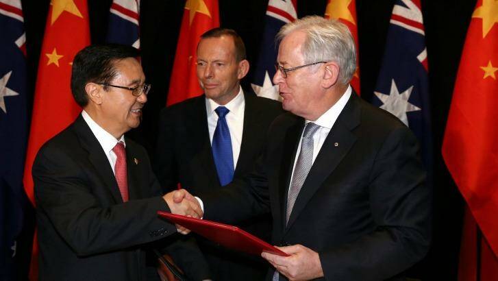 Chinese Commerce Minister Gao Hucheng, former prime minister Tony Abbott and Trade Minister Andrew Robb at the signing of the China-Australia free trade agreement in June.  Photo: Alex Ellinghausen
