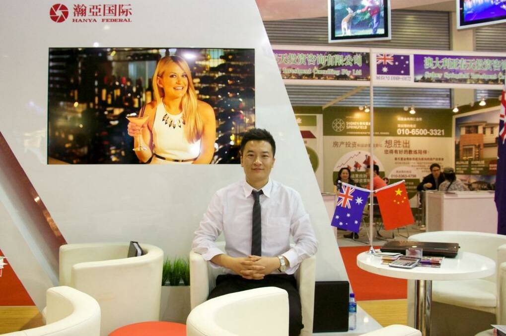 As China's property market becomes less certain, Australia becomes a more attractive destination for China's investors: Wang Peng at a property expo in Beijing. Photo: Sanghee Liu