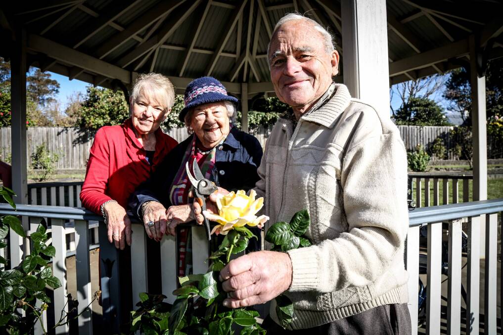Kiama Garden Club's Carol-Ann Trist and Winsome Barker with the Rose Society's Robert Curll at Peace Park preparing for the upcoming Plants, Pots and Posies. Picture: GEORGIA MATTS