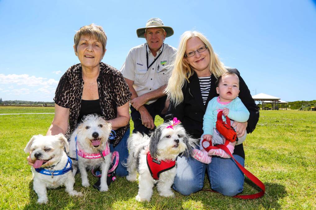 Councillor Helen Stewart, Shellharbour Council Ranger Mark O'Callaghan, and Councillor Kellie Marsh (with seven-month-old Ebony Taylor) preparing for the dogs' day out. Picture: GEORGIA MATTS