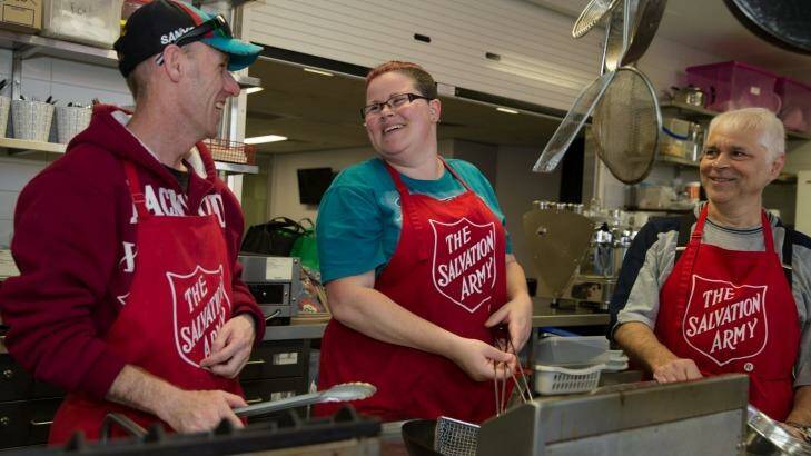 Sean Smith (wearing hat), Patricia Young and Keith Fernandez, working for the dole at the Salvation Army in Auburn, Sydney. Photo: Janie Barrett