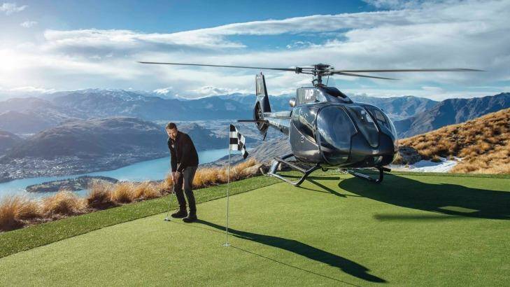 Extreme golf, anyone? A chopper conveys golfers to the green on Cecil Peak. Photo: Fredrik Larsson