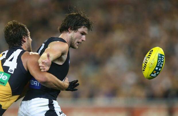 Carlton's Bryce Gibbs is tackled by Ben Griffiths of RIchmond during Thursday's match. Photo: Pat Scala
