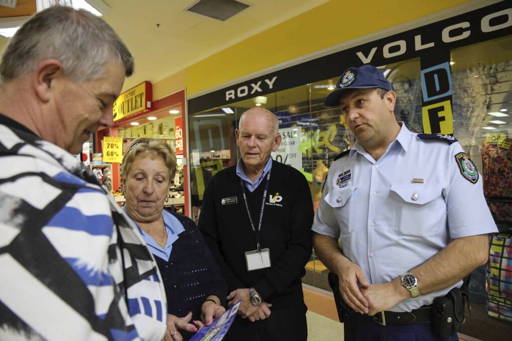 Brad Shilling with volunteers Pam Dickson and Ray Kearin and community safety officer Sergeant Jason Harrison at last week's Warilla Grove visit. Picture: GEORGIA MATTS