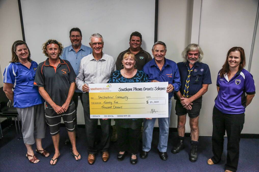 Bill Hilzinger and Rod Oxley presenting Shellharbour City Council with Southern Phone funds for local clubs and organisations. Picture: GEORGIA MATTS