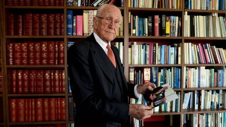 In the non-digital space: Malcolm Fraser. with a photo of Gough Whitlam and himself taken in 2014. Photo: Justin McManus 