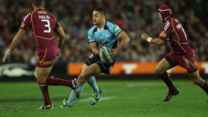 Jarryd Hayne takes on the Maroons defence in game one last year. Photo: Wolter Peeters