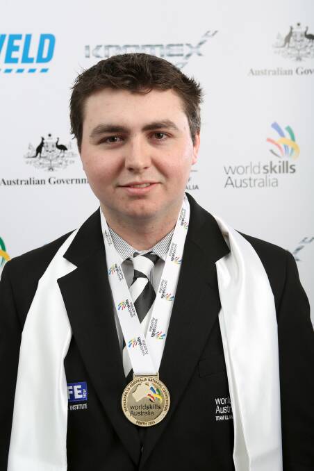 Gerringong's Matt Sawers with the WorldSkills gold medal he won in the turning category.