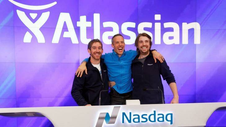 Atlassian co-founders Scott Farquhar (left) and Mike Cannon-Brookes with President Jay Simons during the opening bell ringing ceremony before their IPO last year. Photo: Trevor Collens
