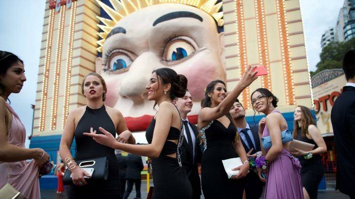 Putting on the Ritz: Year 12 students from Killara High School gather at Milsons Point before their formal at Luna Park. Photo: Wolter Peeters