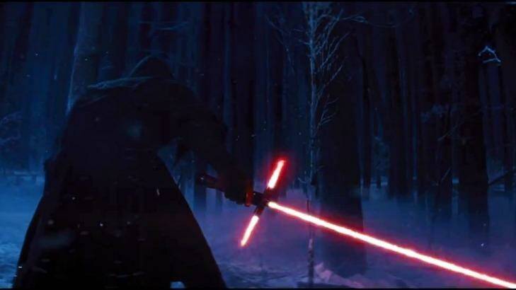Revenge of the Sith Lords? A figure cloaked in black holds a new lightsaber.