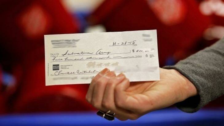 Consigned to history: New electronic funds transfer systems will mean the days of writing out big cheques will be over for most people. Photo: Salvation Army