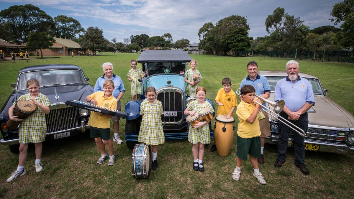 The old and the new - three vintage cars, a 1966 Rolls Royce, a 1926 Chandler and a 1964 Falcon XM Coupe with Minnamurra Public School's Amy Pemberton, Jackson Anthony, Molly Parr, Siye Whitbread, Lily Visser, Sophia Roudback, Jude Bosnet and Aaron Mayo, who will all be part of the entertainment at next Sunday's Minnamurra Lions Club AutumnFest. Also pictured are Minnamurra Lions Club members Ken Magnus, Jack Laidlaw and president Geoff Shoard. Picture: ALBEY BOND
