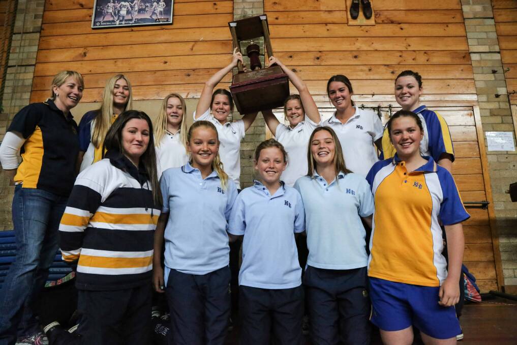 Kiama High School has won the NSW Combined High Schools' Girls' Hockey Championship for the third year in a row. From left are coach (back row) Michelle Winwood, Georgia Wedd, Maddie Taylor, Kelsey Wishart, Riley Wishart, Grace Stewart, Erin Dobson, (front row) Sharna Dobson, Demi Stewart, Sophie Taylor, Lily Stewart and Rowey Worner Butcher. Absent is Montana Marsh, who missed the finals due to injury. Picture: GEORGIA MATTS