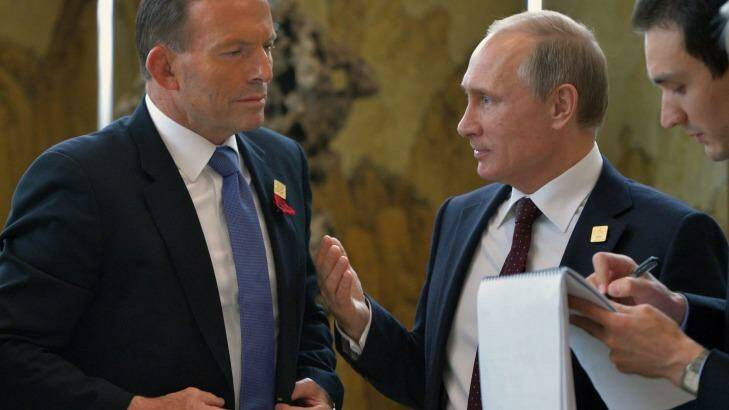Tony Abbott speaks to Vladimir Putin in Beijing on Tuesday. Photo: Alexey Druzhinin