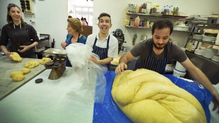 Hellas Cakes' owner Andrew Kantaras, right, makes Greek sweet bread for Easter with the help of family. Photo: Simon O'Dwyer