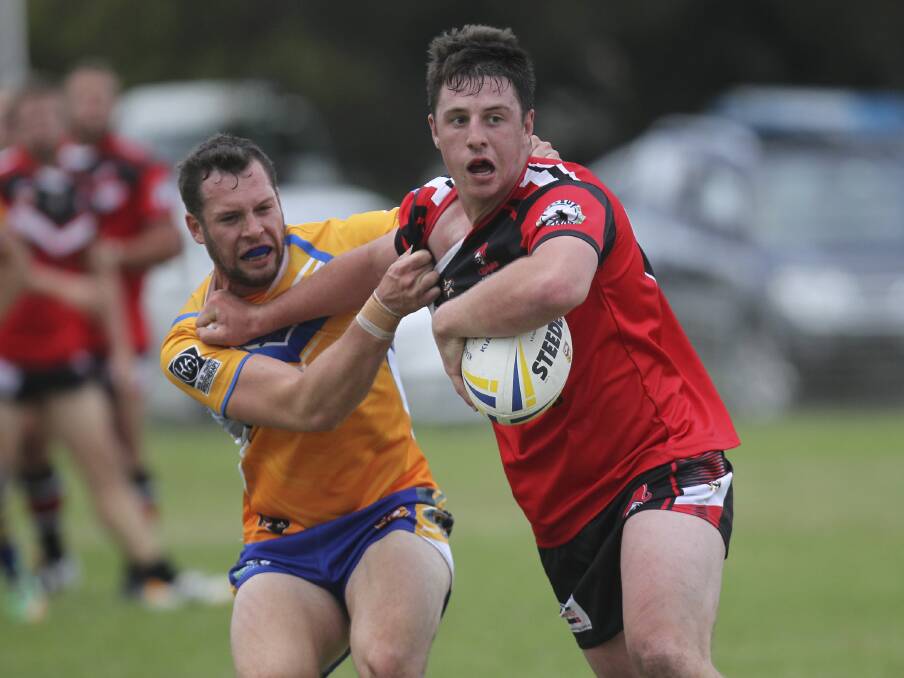 Kiama Knights second-rower Vaughan Thistlethwaite holds off Warilla Gorillas winger Jarryd Pepper in the Gorillas 22-12 win. Picture: DAVID HALL