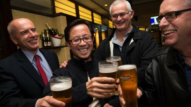 Matthew Ng celebrates his release with his lawyer, Tom Lennox (left) and friends from his days studying at the Australian Graduate School of Management, David Marquard and Ken Wagner.  Photo: Janie Barrett