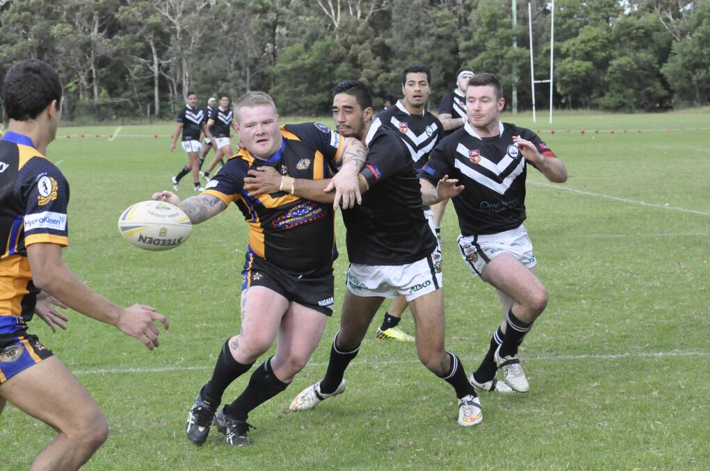 Nowra's Zac Kershaw tries to get the ball away in heavy traffic against Port Kembla. Picture: SOUTH COAST REGISTER