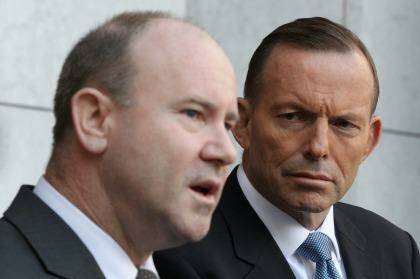 Greg Moriarty, Commonwealth Counter-Terrorism Co-ordinator and Prime Minister Tony Abbott during a press conference. Photo: Alex Ellinghausen