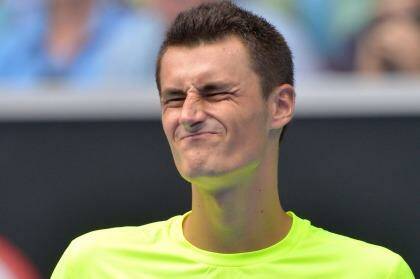 Tame exit: Bernard Tomic reacts during his match against Tomas Berdych. Photo: Joe Armao