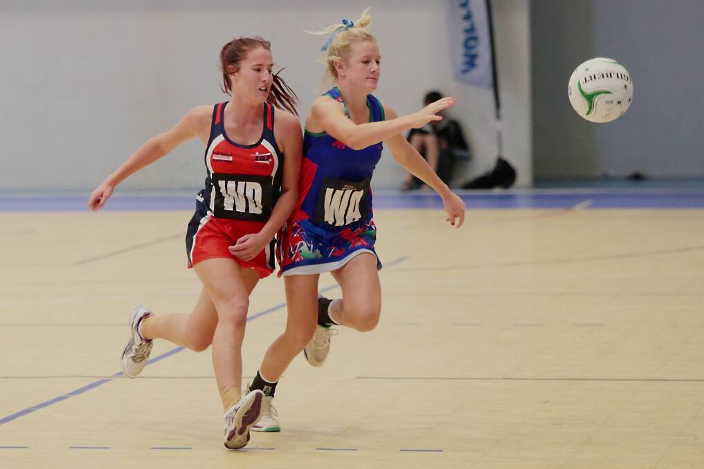 Mackenzie Roberts, from Illawarra, and Courtney Menzies, from Southern Sports, during the Academy Games netball match at the University of Wollongong. Picture: ADAM McLEAN