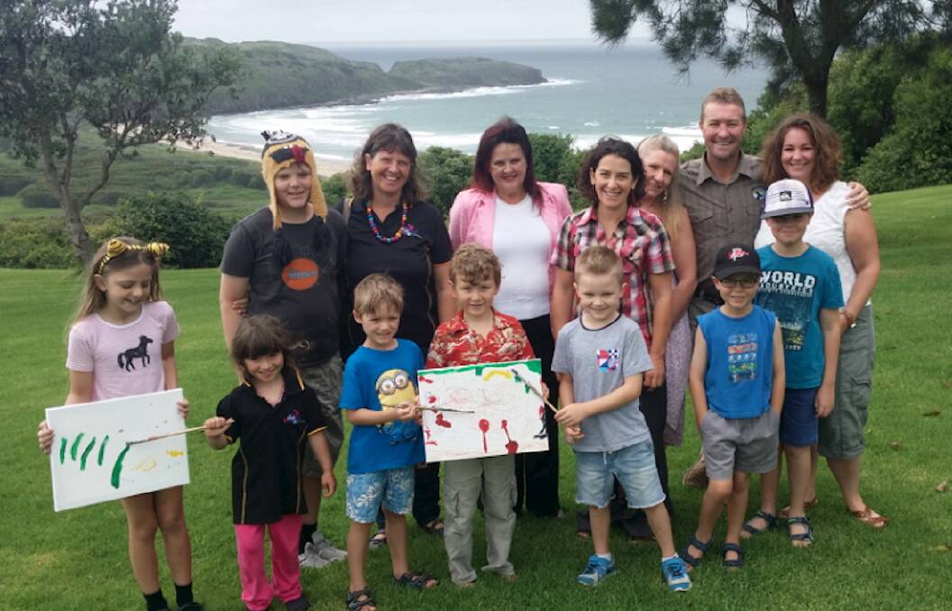 Adults from left - KidsFest artistic co-ordinator Ann Lehmann, Shellharbour MP Anna Watson, Shellharbour artist Anita Larkin, KidsFest president Gennifer Anderson, Killalea park manager Nathan Cattell and Melissa Gillis with a group of children who will participate in the program this year. Picture: Supplied