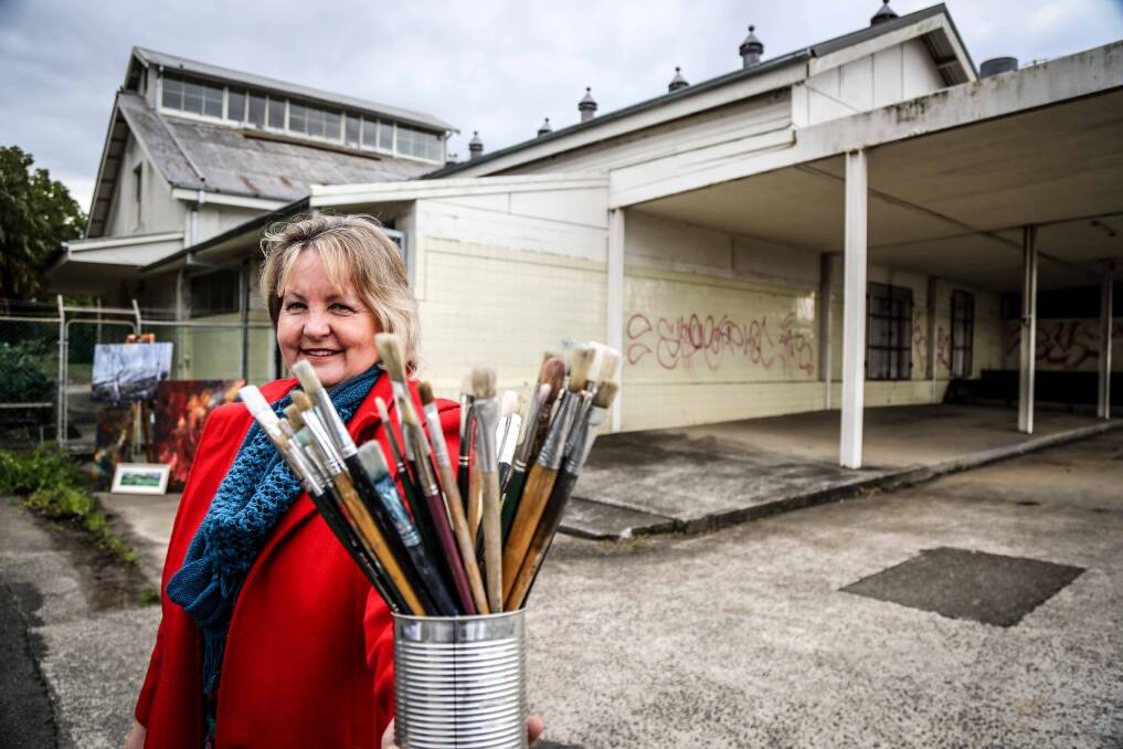 President of the Shellharbour Arts Society Jeanette Riley stands in front of the old dairy co-op building where they are proposing to house a huge arts precinct. Picture: GEORGIA MATTS
