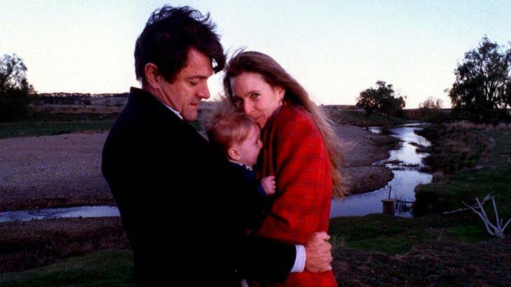 Philip Toyne and his wife Molly hug their son Atticus in 1999.  Photo: Andrew Campbell
