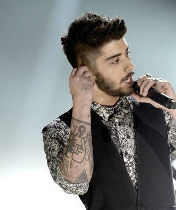 One Direction's Zayn Malik allegedly broke up with his fiancee via text. Photo: Kevin Winter