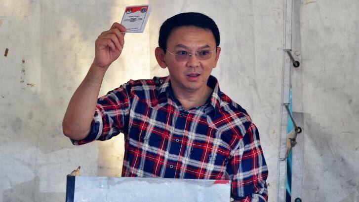 Jakarta's governor Basuki "Ahok" Tjahaja Purnama casts his ballot on Wednesday. Photo: Jefri Tarigan