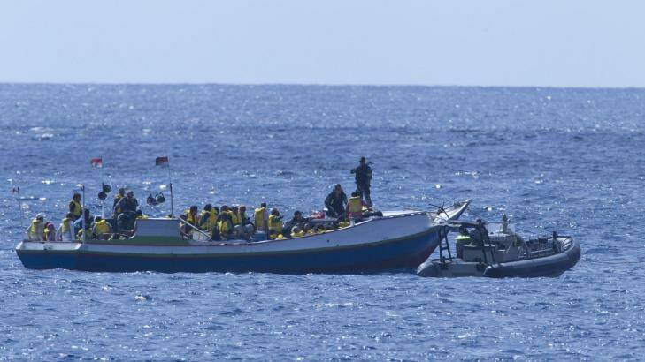 A boat carrying asylum seekers is intercepted by a Customs vessel in 2011. Photo: James Brickwood