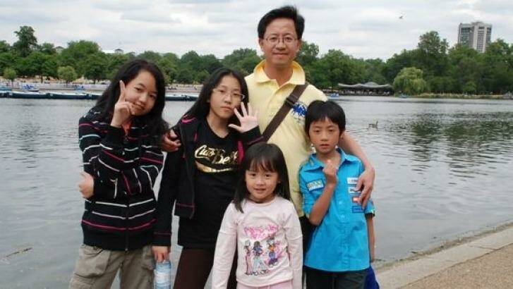 Matthew Ng with his four children before he was jailed in China. 