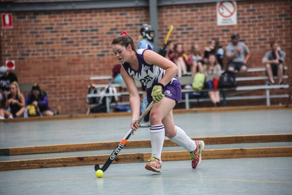 South Coast's Kalindi Commerford launches an attack during their 5-0 win over Illawarra at the NSW State Championships Open Women's Indoor Hockey Championships. Picture: GEORGIA MATTS