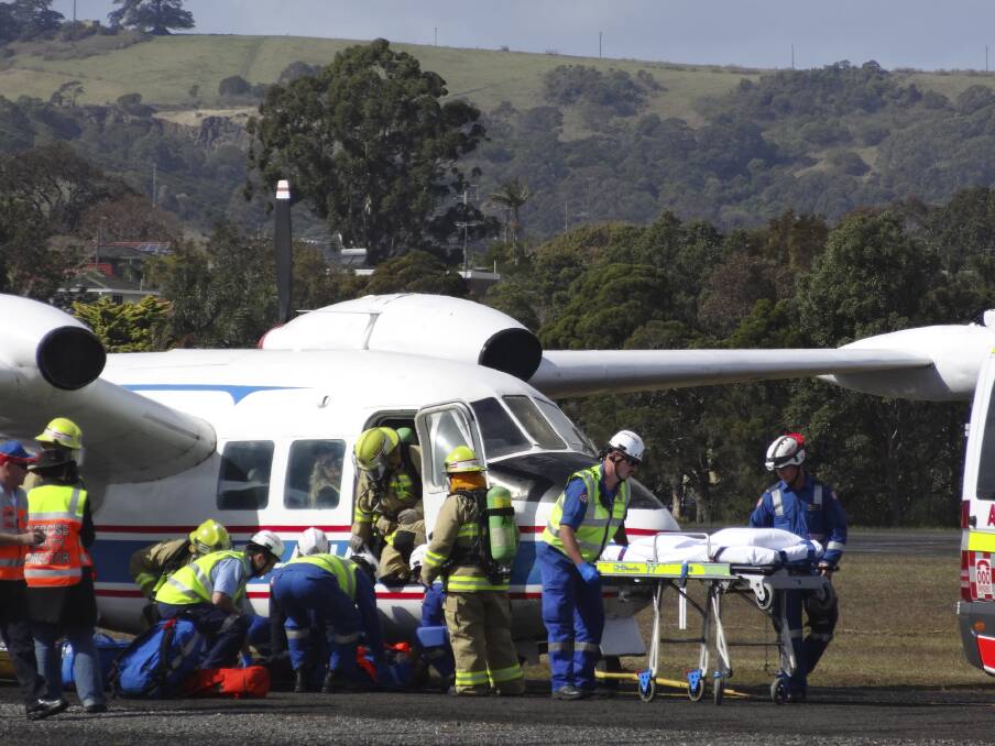 Emergency crews in action as they conduct a mock emergency situation at Illawarra Regional Airport, Albion Park Rail last Thursday.