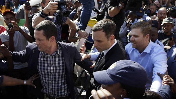 Oscar Pistorius leaves court at the end of the day. 
